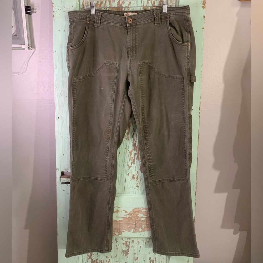 Women’s green Dickies carpenter pants with a relaxed fit